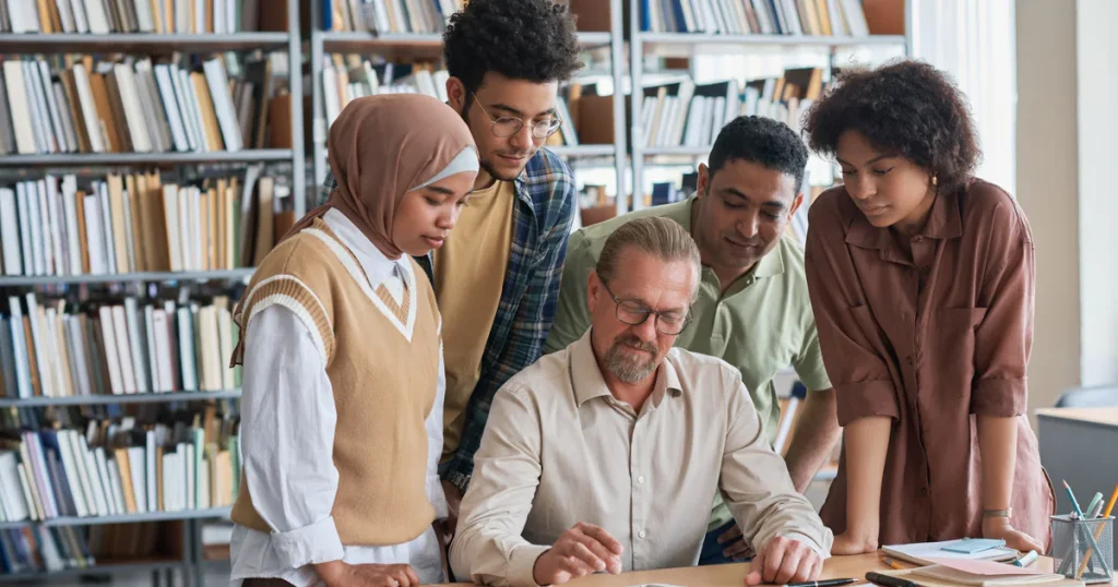 students-using-tablet-pc-with-teacher